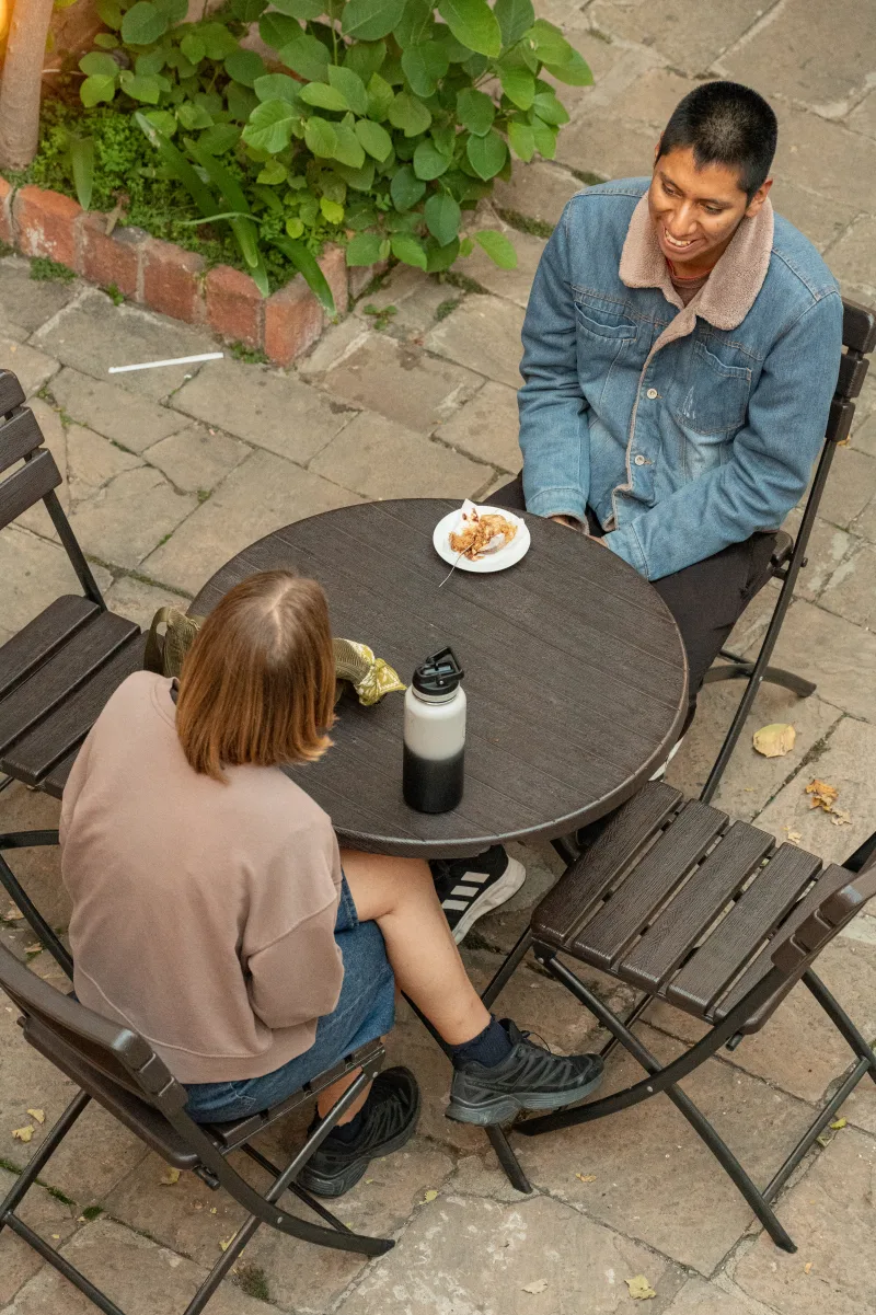 A pair swapping English and Spanish phrases