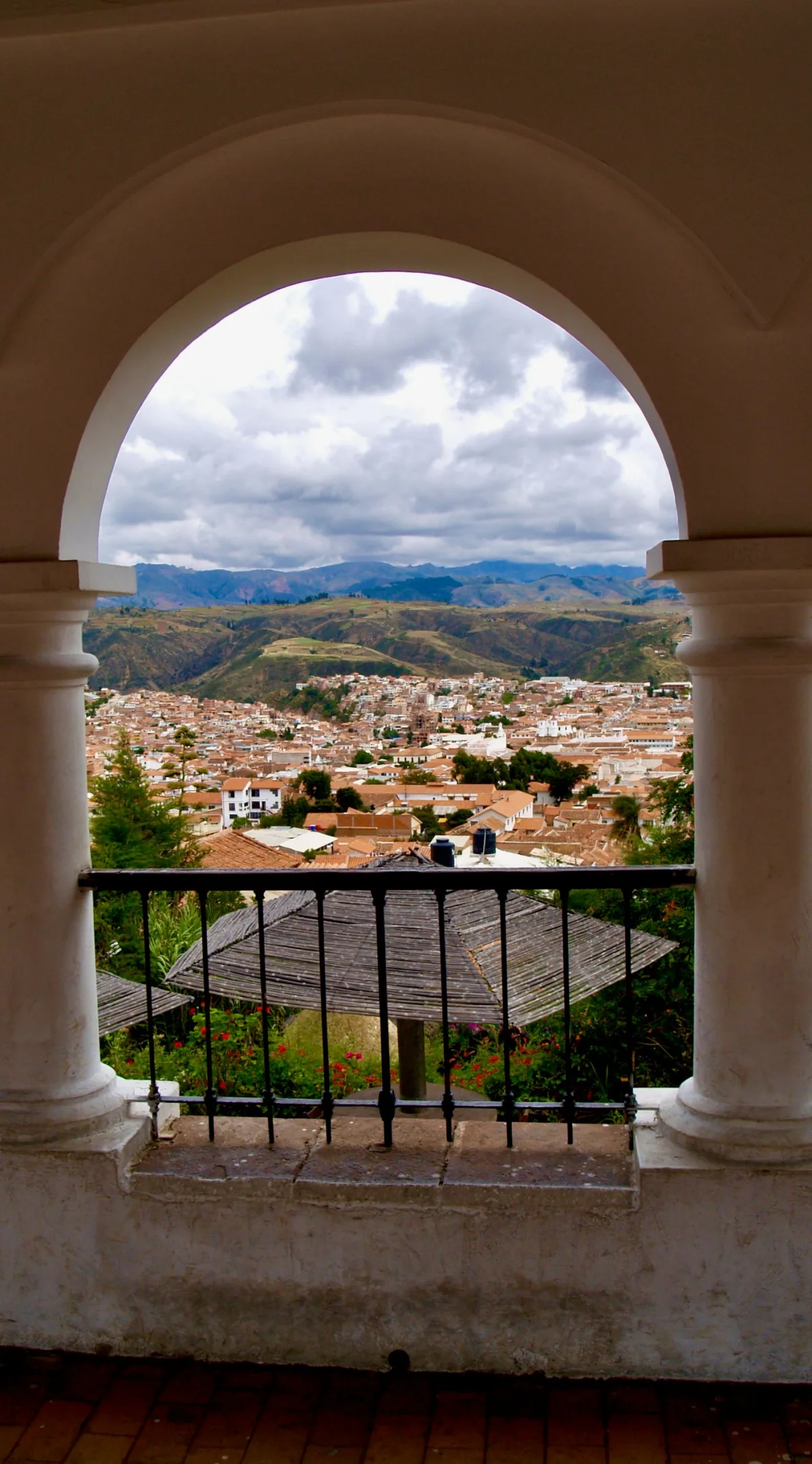 Sucre's white colonial buildings against the Andean foothills