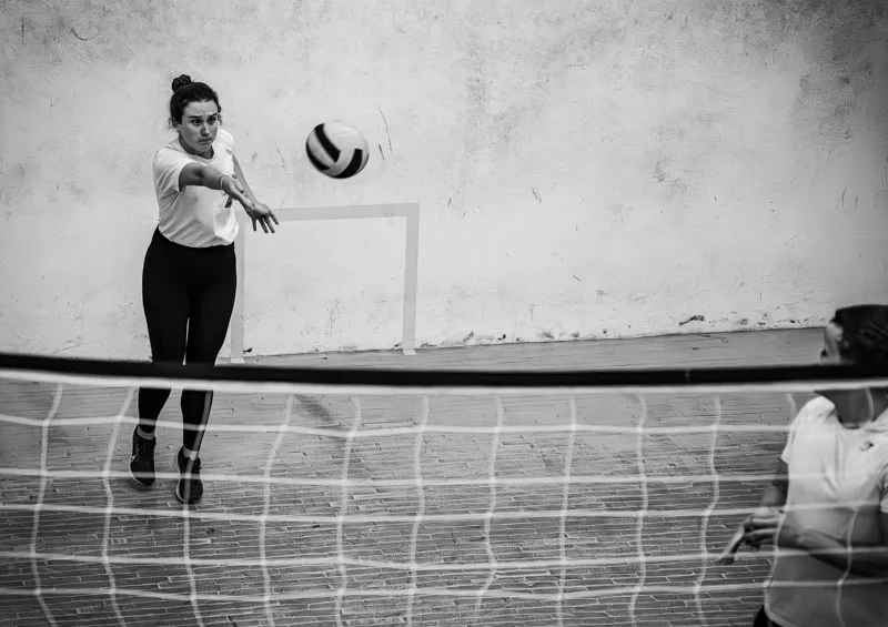 Students mid-game on the wallyball court